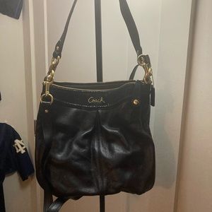 Coach satchel purse , comes with strap , used twice . No stains clean .
